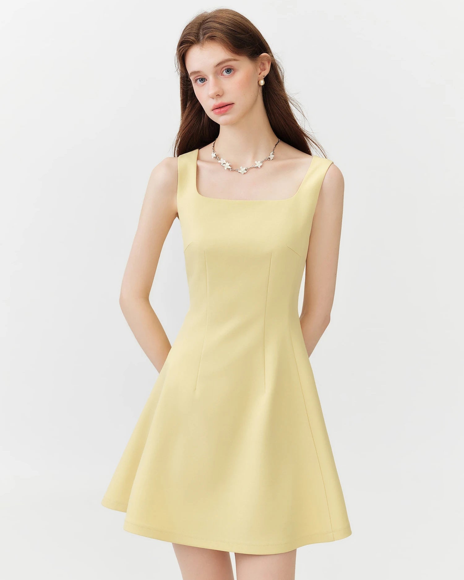 French-inspired sleeveless mini dress. Slim-fitted bodice, square neckline, and A-line flared hem — effortless summer elegance for every occasion.