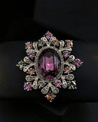 Exquisite vintage crystal brooch in gold tone, elegant round pin with sparkling faceted stones and ornate metalwork, perfect for formal or evening wear.
