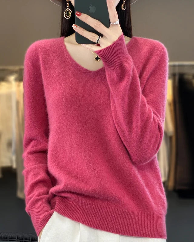 A 100% Australian extrafine merino V-neck sweater with a fine two-ply knit, designed for a regular fit that layers easily under coats and jackets.