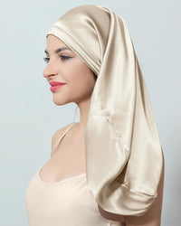 Women's 100% silk sleep hair cap featuring an extra-deep silhouette for long hair, sculpted elastic band, and 16 momme fabric, designed to reduce frizz and retain moisture overnight.