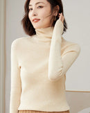 Women's slim-fit turtleneck sweater made from merino wool, featuring a sculpted high neck and breathable warmth for elegant autumn and winter layering.