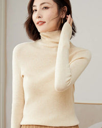 Women's slim-fit turtleneck sweater made from merino wool, featuring a sculpted high neck and breathable warmth for elegant autumn and winter layering.