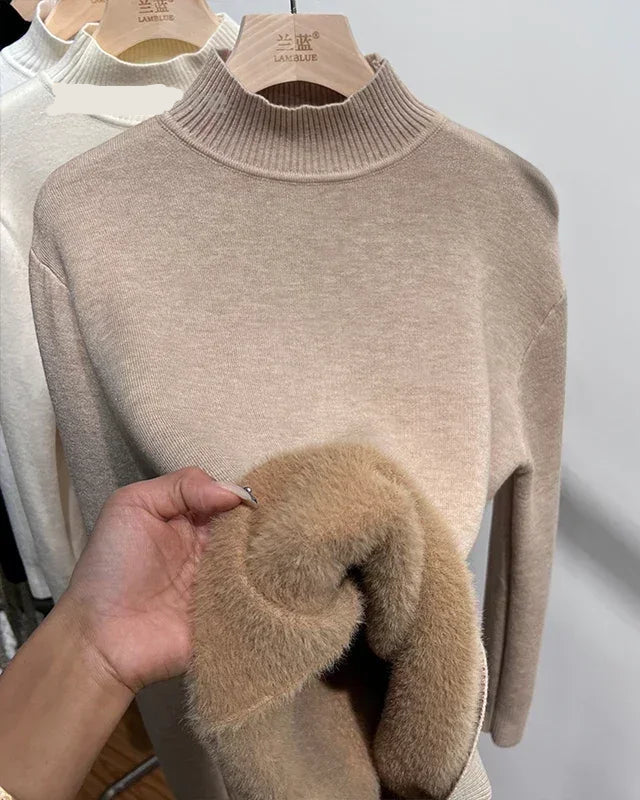 A mock-neck velvet-lined knit pullover with mock neck, velvet lining and regular fit, designed for a cozy winter layering look that pairs from sneakers to boots.