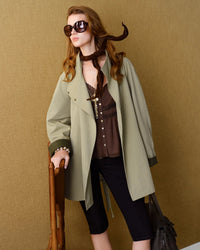 Designed for the woman who dresses with precision, this belted cropped coat offers a clean, considered aesthetic.