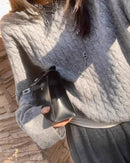 This wool pullover offers a generous, unhurried fit that feels as comfortable as it looks polished.