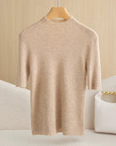 A wool mock neck half sleeve top with a slim fit, designed for lightweight layering that pairs easily with trousers and skirts for office or weekend wear.