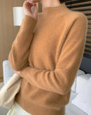 A pure cashmere half-turtleneck pullover featuring a loose fit, raglan sleeves, and a heavyweight knit, designed for effortless elegance and all-season comfort.