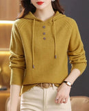 A wool-blend hooded pullover sweater with a relaxed straight cut and medium-weight knit, designed for easy warmth and versatile layering.