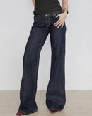 A low-rise flared jean with embroidered appliqué detail, a button fly and slight stretch, designed for a Y2K-inspired look that pairs from sandals to boots.