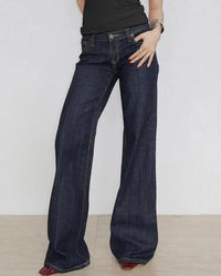A low-rise flared jean with embroidered appliqué detail, a button fly and slight stretch, designed for a Y2K-inspired look that pairs from sandals to boots.