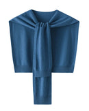 Women's Merino wool knitted shawl cape featuring a sleeveless cape silhouette and fluid drape, crafted from pure Australian wool for lightweight warmth and elegant layering in air-conditioned indoor settings.