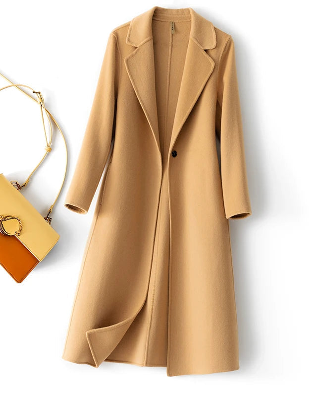 The turn down collar frames the neckline, while a single button closure and useful pockets keep the finish quietly functional.