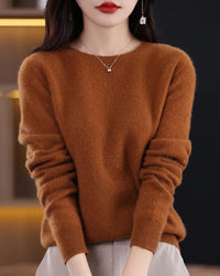 A pure merino wool O-neck knit sweater with a slim fit, designed for soft warmth and versatile layering in autumn and winter.