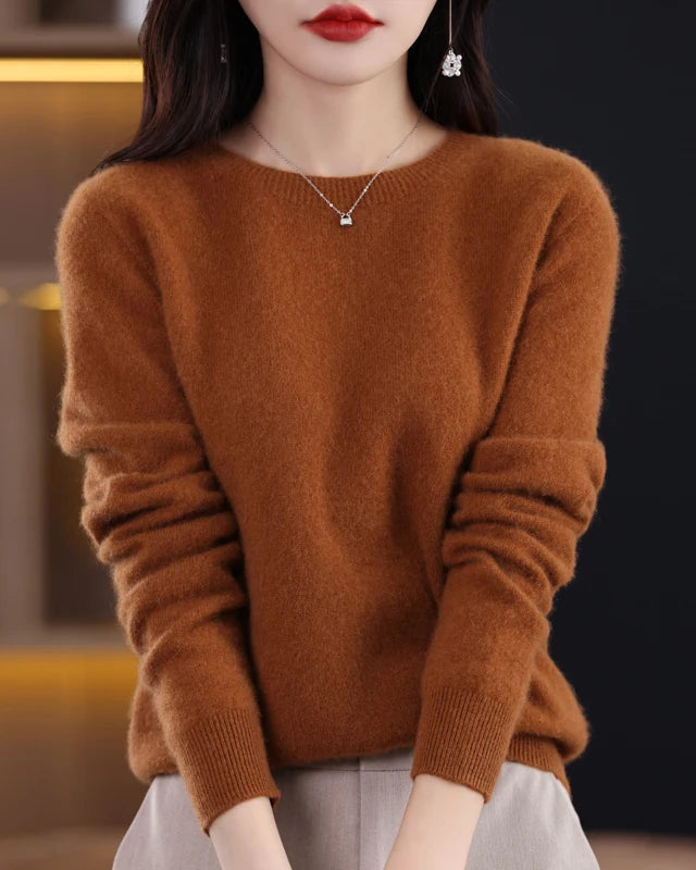 A pure merino wool O-neck knit sweater with a slim fit, designed for soft warmth and versatile layering in autumn and winter.