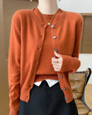 A wool knit twinset with crewneck, button-front cardigan, short-sleeve pullover, ribbed trims, regular fit, designed for a cozy winter layering look that pairs from sneakers to boots.