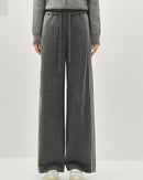 A striped wide-leg ankle pant with a mid waist, elastic waistband and side pockets, designed for a relaxed polished look that pairs from sneakers to boots.