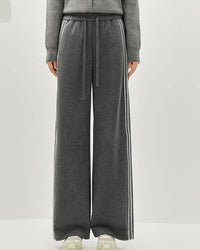 A striped wide-leg ankle pant with a mid waist, elastic waistband and side pockets, designed for a relaxed polished look that pairs from sneakers to boots.