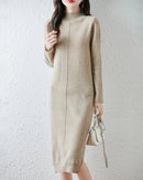 A 100% merino wool turtleneck midi dress with a straight H-line and full sleeves, designed for poised ease from a cold morning commute to dinner.