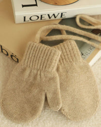 Kids Cashmere knit mittens featuring a sculpted ribbed cuff, 16G fine knit, and 100% cashmere fabric, perfect for delivering poised warmth in cold office environments.