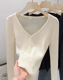A cotton-blend V-neck knit pullover with slight stretch, full sleeves and button detail, designed for a polished autumn look that layers from day to evening.