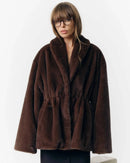 A thickened faux fur winter coat with a turn-down collar and single-breasted front, designed for a plush, warm look in cold weather.