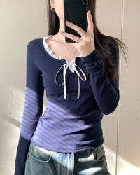 A Korean-style polyester long-sleeve top with an O-neck and bow patchwork detail, designed for easy polished wear that layers from campus to casual evenings.