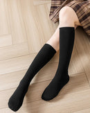 Women's Wool blend ribbed calf socks featuring a sculpted ribbed cuff, 35cm calf-length silhouette, and fine yarn knit, perfect for delivering poised warmth in cold office environments.
