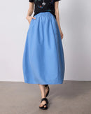 High-waist cocoon-shape midi skirt with a slimming A-line silhouette and textured wrinkle finish. Solid colour, slim fit — effortless casual style for summer.