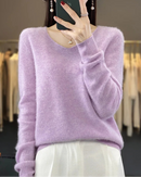 Women's Merino Wool V-neck pullover featuring a seamless silhouette and delicate texture, crafted from pure Australian wool for breathable warmth and elegant layering in air-conditioned indoor settings.