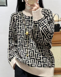 A printed cashmere sweater with printed design, thick knit, loose fit, long sleeves and stretch, designed for a cozy winter layering look that pairs from sneakers to boots.