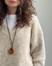 A Loose Soft V-Neck Sweater With A Scarf