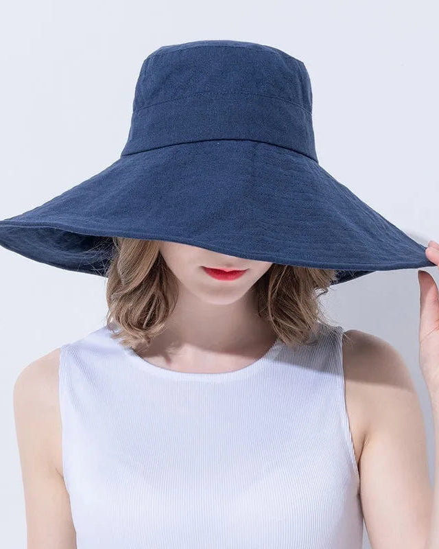 Women's Foldable Wide-brim sun hat crafted from breathable cotton-linen blend, featuring a 15cm oversized brim and adjustable inner band for versatile UV protection.