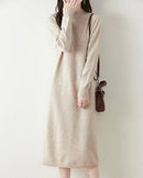 A mid-calf merino wool mock neck knit dress with a straight cut, designed for soft single-thread warmth that layers easily from commute to dinner.
