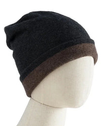 A double-faced cashmere and wool beanie with a two-tone knit and close fit, designed to cover the ears for lightweight warmth that packs easily.