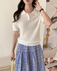 Women's polo collar button-down knit top crafted from breathable cotton with a refined trim and double-stitched seams for durable, polished comfort in spring and summer.