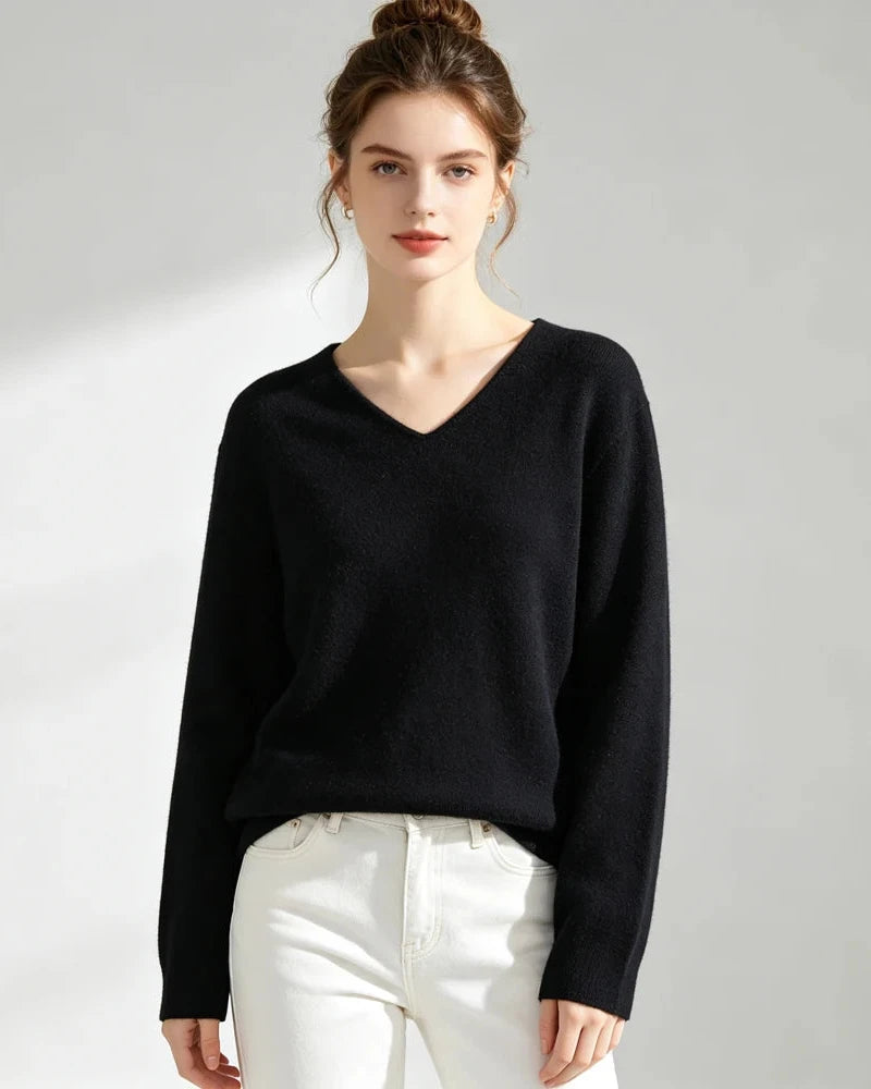 A 100% wool V-neck sweater with softly rolled edges and a straight fit, designed for poised warmth that layers easily from commute to dinner.