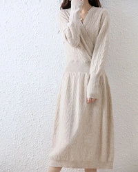 Cable-knit merino wool wrap-look dress for women with crossover V-neck, ribbed waist, flared A-line skirt and long sleeves, a soft fall-winter dress for polished wear.