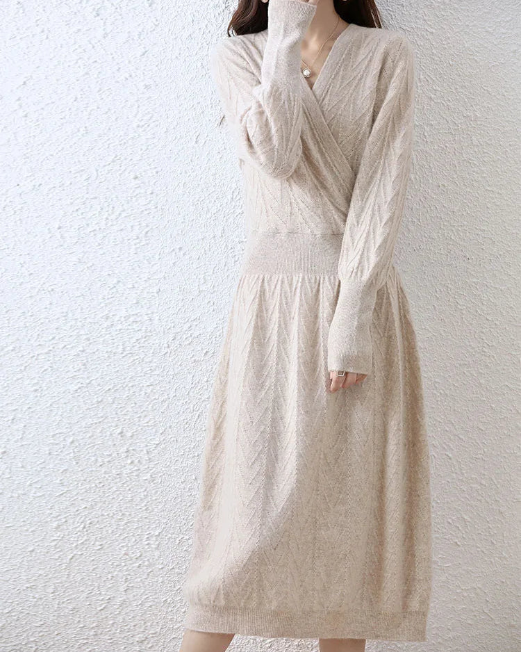Cable-knit merino wool wrap-look dress for women with crossover V-neck, ribbed waist, flared A-line skirt and long sleeves, a soft fall-winter dress for polished wear.
