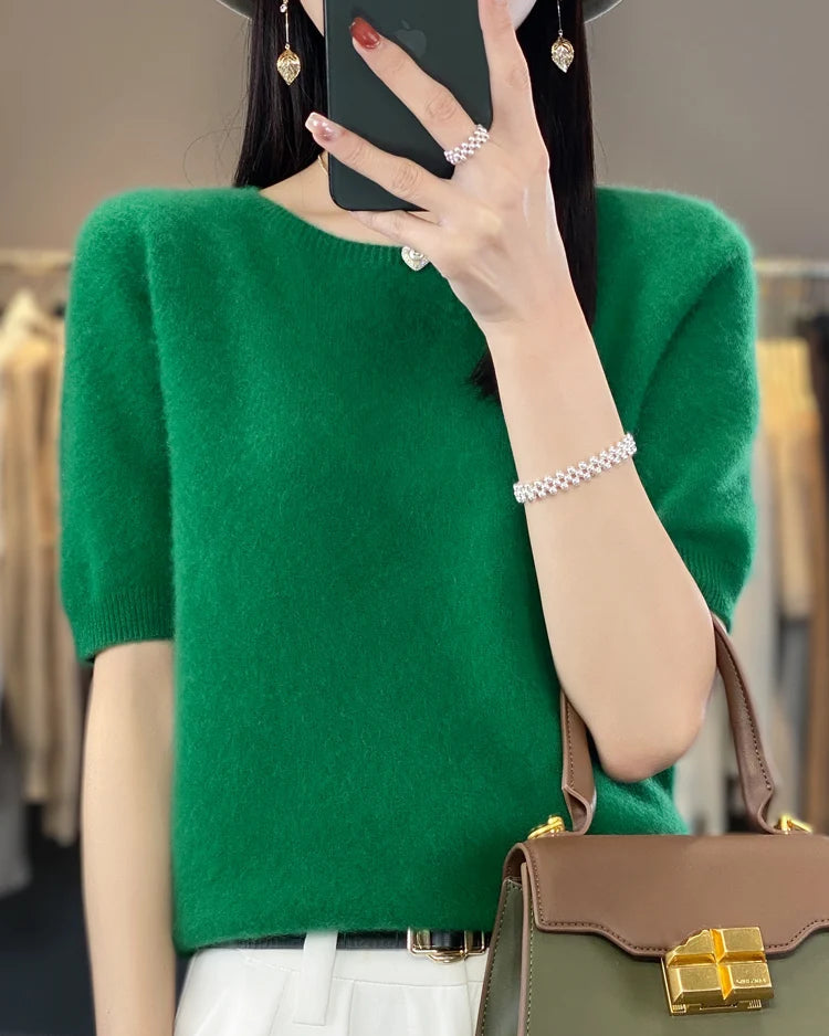 Women's Extrafine merino wool short-sleeve sweater featuring a slim silhouette and 17.9-micron superfine fibre, crafted from pure Australian wool for breathable warmth and elegant layering in air-conditioned indoor settings.