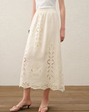 Women's embroidered linen A-line midi skirt, crafted from 100% breathable linen and featuring a flattering silhouette and delicate embroidery—perfect for an effortless look that transitions seamlessly from poolside lounging to evening dining.