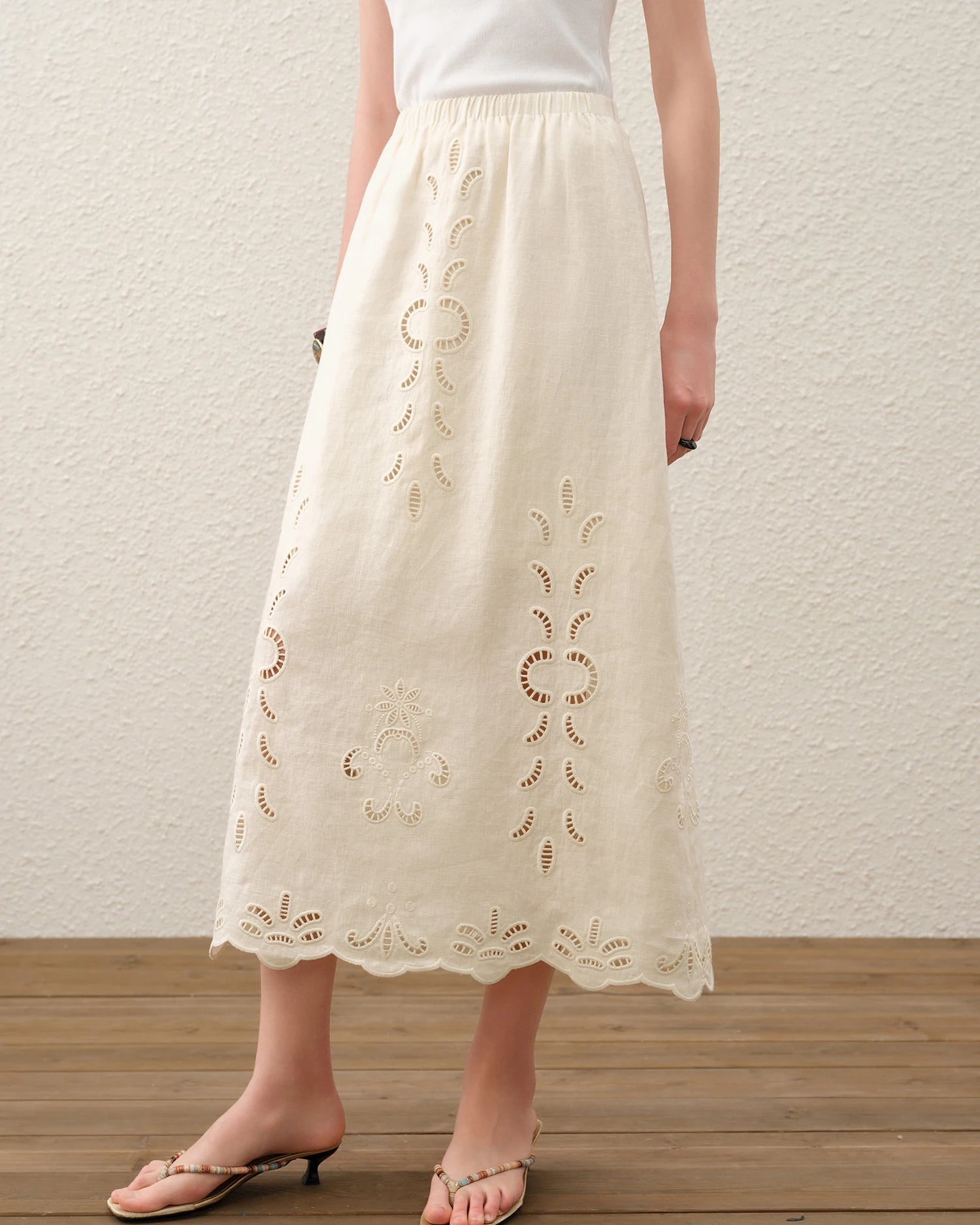 Women's embroidered linen A-line midi skirt, crafted from 100% breathable linen and featuring a flattering silhouette and delicate embroidery—perfect for an effortless look that transitions seamlessly from poolside lounging to evening dining.