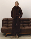 A Loose Soft V-Neck Sweater With A Scarf