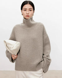 Discover our ultra-soft oversized turtleneck sweater with ribbed details and wool-cashmere blend. Perfect for winter layering, office styling, and cold-weather comfort. 