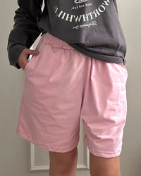 High-waist elastic waist casual shorts for women. Soft cotton-blend fabric, relaxed fit, and a versatile design perfect for summer lounging and everyday wear.