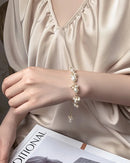 A delicate bracelet featuring lustrous baroque freshwater pearls on a durable 14K gold filled chain, designed for an elegant, everyday look.