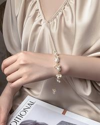 A delicate bracelet featuring lustrous baroque freshwater pearls on a durable 14K gold filled chain, designed for an elegant, everyday look.
