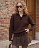 A relaxed-fit mock-neck sweater featuring a quarter-zip closure, a stand collar, and an oversized silhouette for effortless layered warmth.