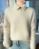 A thick turtleneck sweater crafted from extrafine merino wool with a zip neck and loose fit, designed for deep winter warmth and comfort.