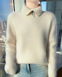 A thick turtleneck sweater crafted from extrafine merino wool with a zip neck and loose fit, designed for deep winter warmth and comfort.