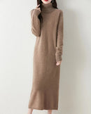 A mid-calf merino wool turtleneck knit dress with a straight H-line cut, designed for soft single-thread warmth that layers easily from commute to dinner.